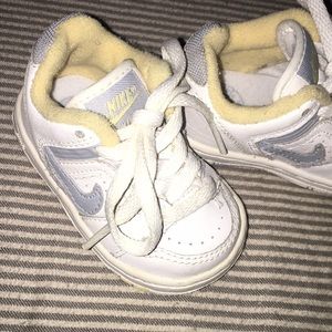 Yellow white and grey baby nikes